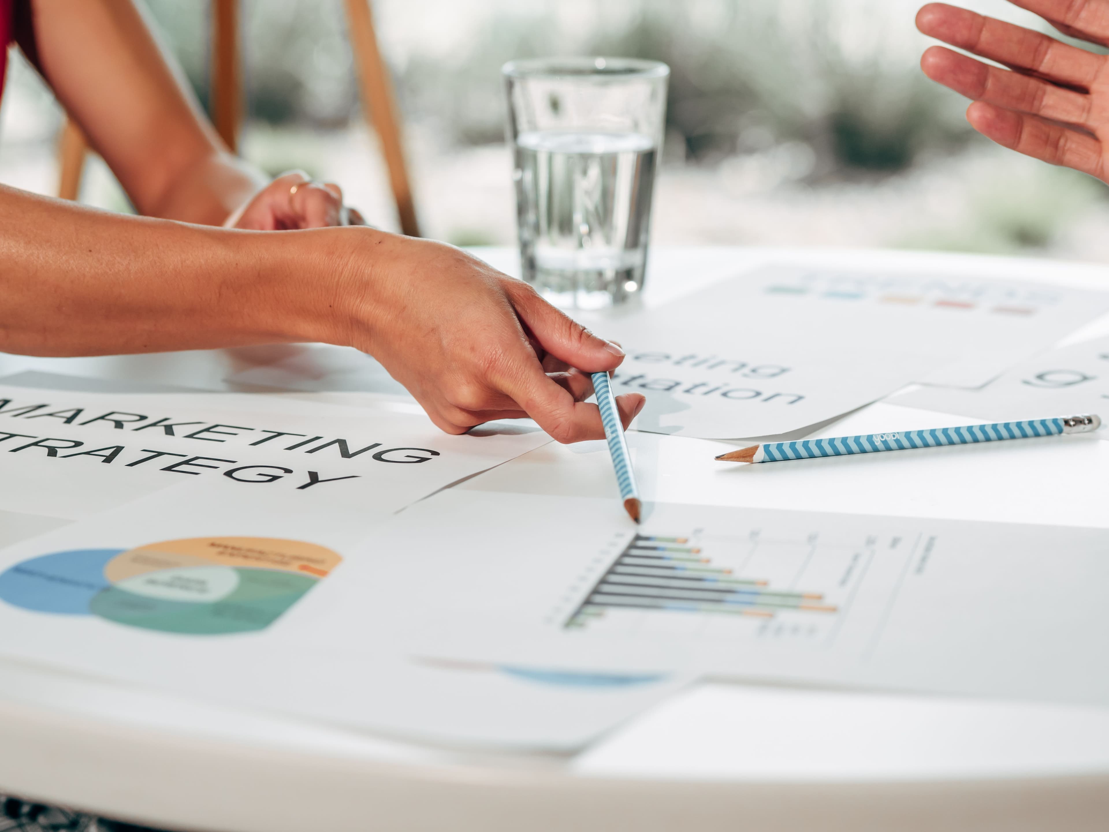 A product and planning team working together around notes and a laptop.